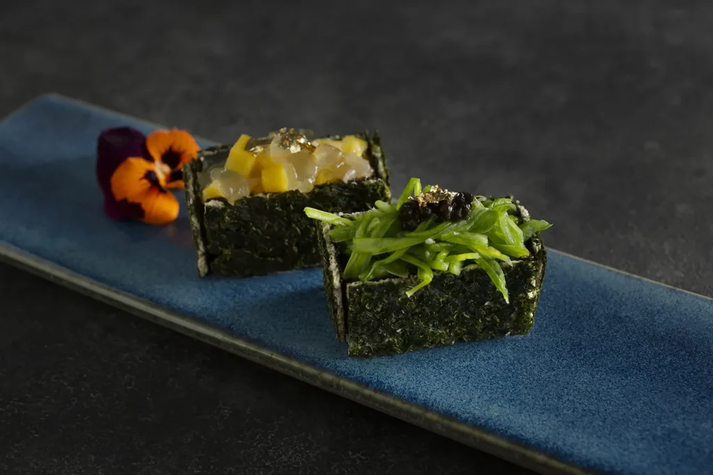 A vegan fine dining dish with a sushi duo